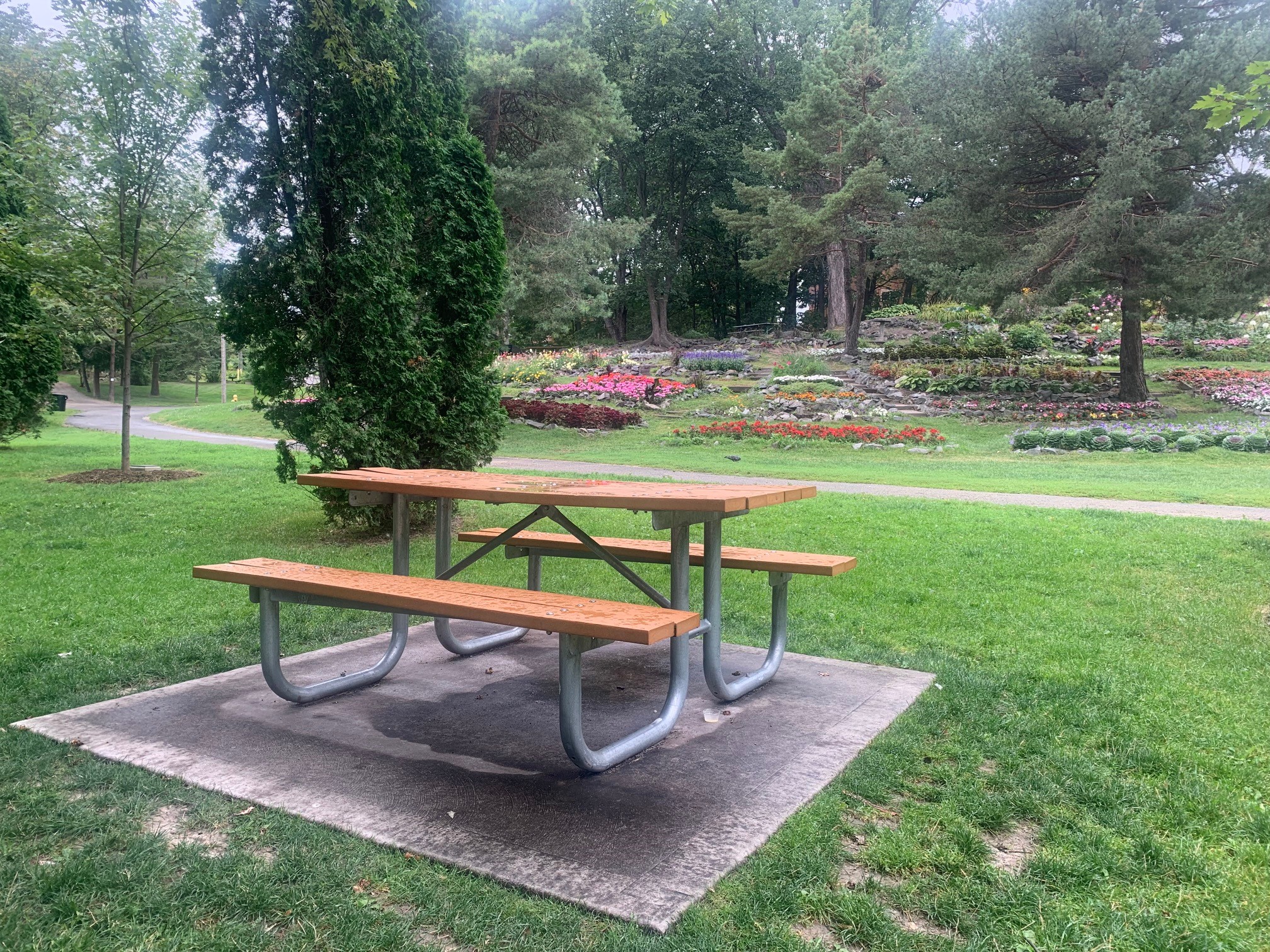 Memorial gift- picnic table in front of flower garden at Bell Park